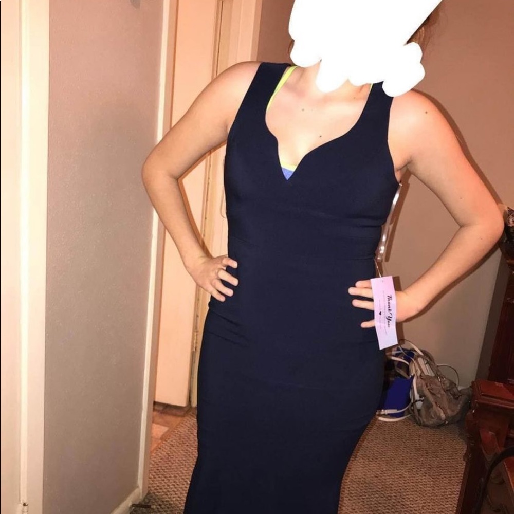 Navy plus Mermaid fit dress with a vneck cut. Perfect for any formal occasion!